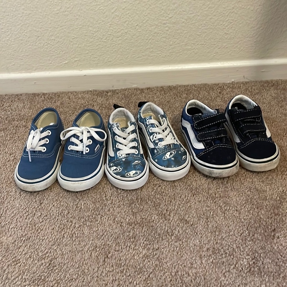 Three pairs of blue Vans